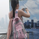 Illustration for article titled Smogged-out tourists use fake city skylines for Hong Kong photos